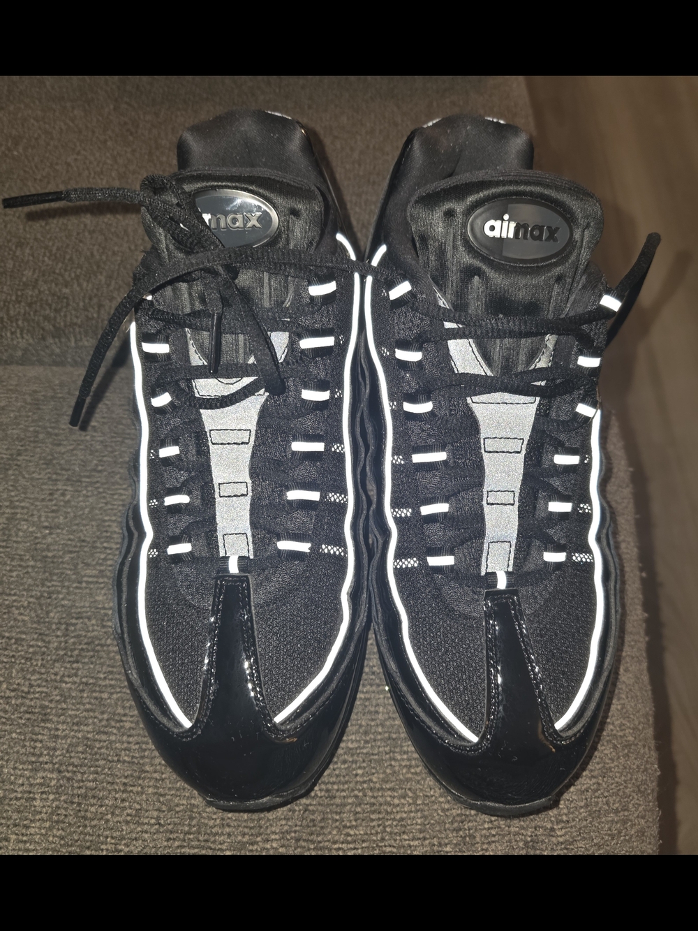 Nike Women’s Black Sneakers with Reflective Silver Accents